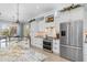 Well-equipped kitchen with stainless steel appliances, marble countertops, and ample cabinet space at 13064 N Marsh Dr, Port Charlotte, FL 33953