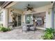 Lanai with outdoor seating, decorative plants, brick pavers and sliding glass doors to the interior at 13064 N Marsh Dr, Port Charlotte, FL 33953
