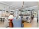 Open concept living space flows to the kitchen featuring lots of natural light and neutral paint colors at 13064 N Marsh Dr, Port Charlotte, FL 33953
