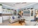 Open concept living space featuring neutral paint colors, and an entertainment center with a large TV at 13064 N Marsh Dr, Port Charlotte, FL 33953