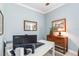 Office with a white desk, decor, neutral paint, and a printer on a nearby shelf at 13064 N Marsh Dr, Port Charlotte, FL 33953