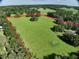 Spacious acreage with green pasture, mature trees, and a red border marking property lines at 17380 Sweetwater Rd, Dade City, FL 33523