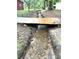 View of wooden bridge spanning a rock-bottomed creek and natural setting at 17380 Sweetwater Rd, Dade City, FL 33523