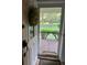 Welcoming home entrance with a seasonal wreath, leading to a spacious outdoor vista at 17380 Sweetwater Rd, Dade City, FL 33523
