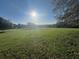 Spacious grassy land under a bright sky, ideal for development or recreational use in a serene setting at 17380 Sweetwater Rd, Dade City, FL 33523