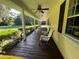 Inviting covered porch featuring comfortable seating and scenic outdoor views at 17380 Sweetwater Rd, Dade City, FL 33523