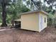 Exterior view of shed with white door and window at 17380 Sweetwater Rd, Dade City, FL 33523