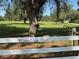 Willow Creek Ranch, a picturesque property surrounded by sprawling green fields at 17380 Sweetwater Rd, Dade City, FL 33523