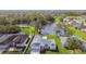 Birds-eye view of homes around a lake, showcasing the neighborhood's appeal at 3118 34Th Avenue E Dr, Bradenton, FL 34208