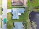 Aerial of backyard, showing well maintained lawn and neighborhood lake at 3118 34Th Avenue E Dr, Bradenton, FL 34208
