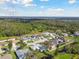 Aerial view of homes and neighborhood with mature trees at 3118 34Th Avenue E Dr, Bradenton, FL 34208