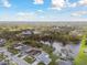 Beautiful aerial view of homes surrounding a tranquil lake and lush greenery at 3118 34Th Avenue E Dr, Bradenton, FL 34208