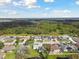 Homes and lush greenery bordering a tranquil lake at 3118 34Th Avenue E Dr, Bradenton, FL 34208