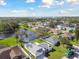 An aerial view of the homes and landscape including a beautiful lake at 3118 34Th Avenue E Dr, Bradenton, FL 34208