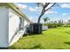 A well-maintained backyard featuring a storage shed and green lawn at 3118 34Th Avenue E Dr, Bradenton, FL 34208