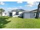 Backyard with a storage shed, mature tree, and a well-manicured lawn at 3118 34Th Avenue E Dr, Bradenton, FL 34208