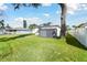 Spacious backyard features a storage shed and a large tree providing shade at 3118 34Th Avenue E Dr, Bradenton, FL 34208