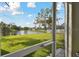 View from the screened-in porch of the backyard, pond, and landscaping at 3118 34Th Avenue E Dr, Bradenton, FL 34208