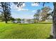 Expansive backyard featuring a scenic pond and lush greenery at 3118 34Th Avenue E Dr, Bradenton, FL 34208