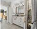 Bright bathroom featuring a walk-in shower, and dark granite countertops and hardware at 3118 34Th Avenue E Dr, Bradenton, FL 34208