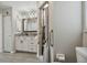 Neutral-toned bathroom featuring a walk-in shower with granite countertops and dark hardware at 3118 34Th Avenue E Dr, Bradenton, FL 34208