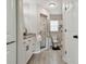 Neutral-toned bathroom featuring a walk-in shower, granite countertops, and a convenient linen cabinet at 3118 34Th Avenue E Dr, Bradenton, FL 34208