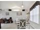 Dining area featuring a chandelier and an adjacent office space at 3118 34Th Avenue E Dr, Bradenton, FL 34208