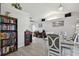 Open dining room with gray wood floors, a chandelier, and office space in view at 3118 34Th Avenue E Dr, Bradenton, FL 34208