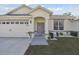 Beautiful home with a two-car garage, manicured lawn, and a welcoming front entrance at 3118 34Th Avenue E Dr, Bradenton, FL 34208
