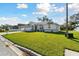 Single-Gathering home boasts a well-manicured lawn and a convenient two-car garage at 3118 34Th Avenue E Dr, Bradenton, FL 34208