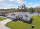 Lovely home with a spacious lawn, long driveway, and view of a tranquil lake at 3118 34Th Avenue E Dr, Bradenton, FL 34208