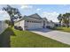 Lovely home with a spacious two-car garage, and a well-kept lawn at 3118 34Th Avenue E Dr, Bradenton, FL 34208