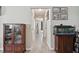 Bright hallway with tile flooring, neutral paint, and stylish décor at 3118 34Th Avenue E Dr, Bradenton, FL 34208