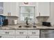 Well-lit kitchen features stainless steel appliances and attractive countertops at 3118 34Th Avenue E Dr, Bradenton, FL 34208