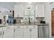 This bright kitchen features stainless steel appliances and gray countertops at 3118 34Th Avenue E Dr, Bradenton, FL 34208