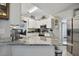 Updated kitchen features stainless steel appliances and gray countertops at 3118 34Th Avenue E Dr, Bradenton, FL 34208