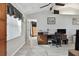 Living room with wood-look floors, a vaulted ceiling, and office space at 3118 34Th Avenue E Dr, Bradenton, FL 34208