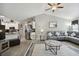 Open-concept living room with modern furnishings, vaulted ceiling, and updated flooring at 3118 34Th Avenue E Dr, Bradenton, FL 34208