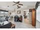 Open-concept living space with dining, kitchen, and office areas, perfect for versatile living at 3118 34Th Avenue E Dr, Bradenton, FL 34208