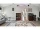 A spacious living room with wood floors, a marble coffee table, and elegant furnishings at 3118 34Th Avenue E Dr, Bradenton, FL 34208