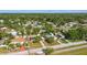 An aerial view of a residential neighborhood with tree-lined streets and well-maintained homes at 7214 Oakwood Dr, New Port Richey, FL 34652