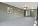 Spacious screened-in patio with painted concrete floor and ceiling fan at 7214 Oakwood Dr, New Port Richey, FL 34652
