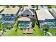 An aerial view shows the home, its screened-in pool, backyard dock and the solar panels on the roof at 18018 Malakai Isle Dr, Tampa, FL 33647