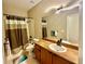 Well-lit bathroom featuring a shower-tub combination and modern vanity with countertop at 18018 Malakai Isle Dr, Tampa, FL 33647