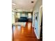 Expansive bedroom with wood flooring, ceiling fan, and views, offering a serene retreat at 18018 Malakai Isle Dr, Tampa, FL 33647