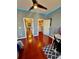 Bright bedroom with wood floors, two closets, doors, and a desk area at 18018 Malakai Isle Dr, Tampa, FL 33647