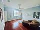 Inviting bedroom with hardwood floors, chair, and a large window offering abundant natural light at 18018 Malakai Isle Dr, Tampa, FL 33647