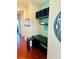 Inviting hallway nook with a built-in desk, shelving, and a decorative accent wall at 18018 Malakai Isle Dr, Tampa, FL 33647