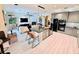 Open kitchen featuring an island with barstool seating and open to the living room at 18018 Malakai Isle Dr, Tampa, FL 33647