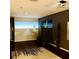 Living room featuring a large screen, projector, and wood floors, for the ultimate media experience at 18018 Malakai Isle Dr, Tampa, FL 33647